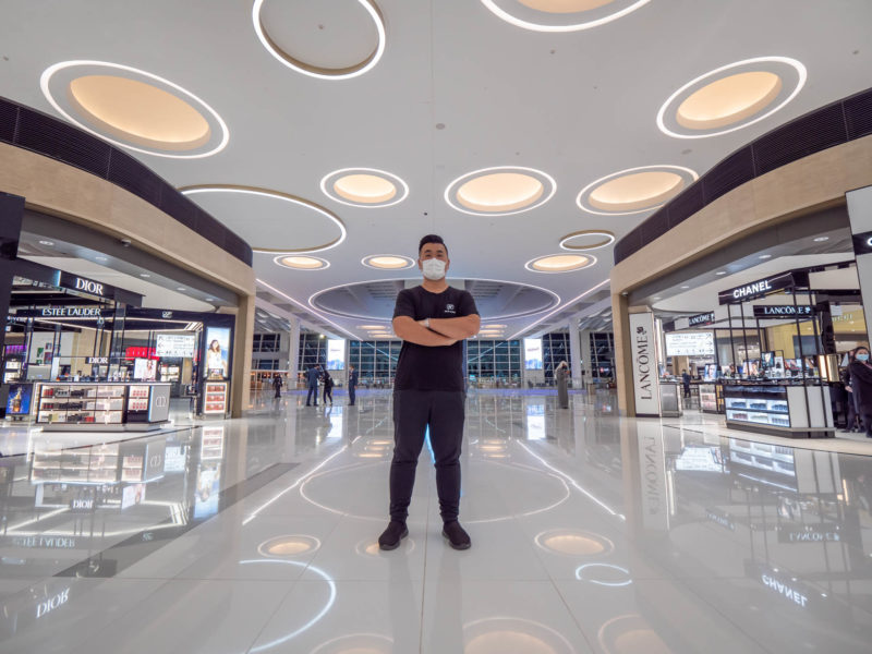 a man wearing a mask in a mall