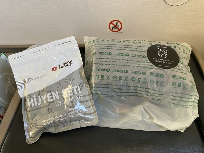 a plastic bag next to a bag of medical supplies