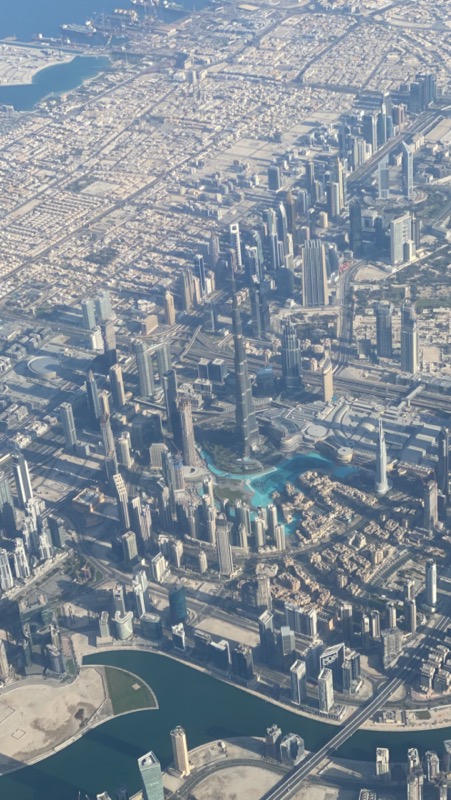 Flying over Downtown Dubai with The World's Tallest Building below; Burj Khalifa