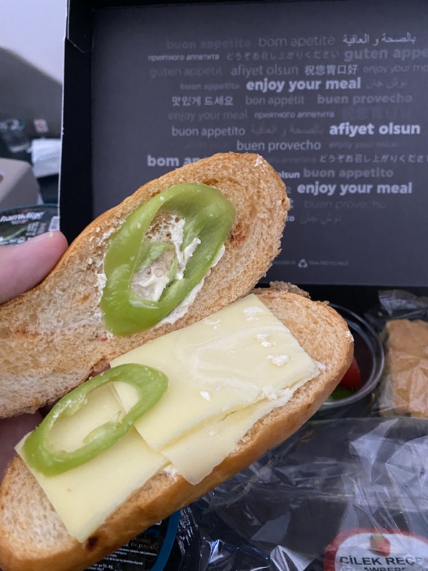 a sandwich with cheese and jalapenos
