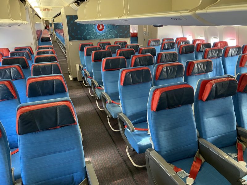 a plane with blue and red seats