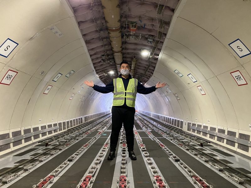 a man wearing a mask and standing in a tunnel