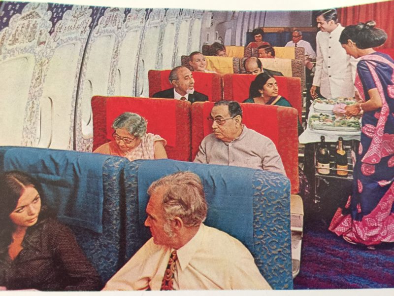 a group of people sitting in chairs on an airplane