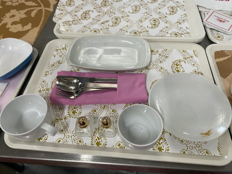 a tray with plates and utensils on it