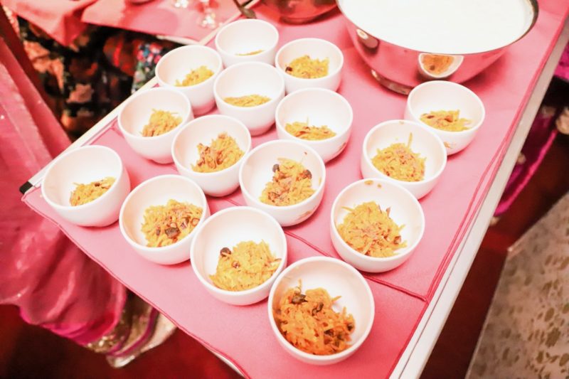 a group of small white bowls with food in them