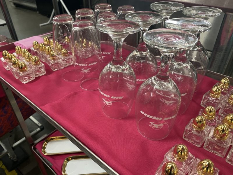 a table with wine glasses and other items on it