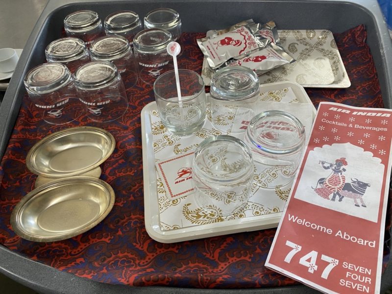 a tray with glasses and cups on it
