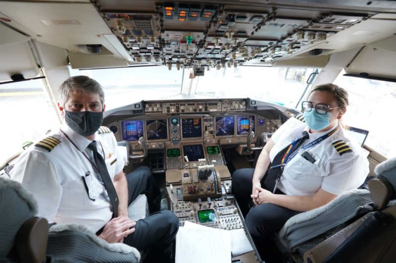 a couple of pilots in a cockpit