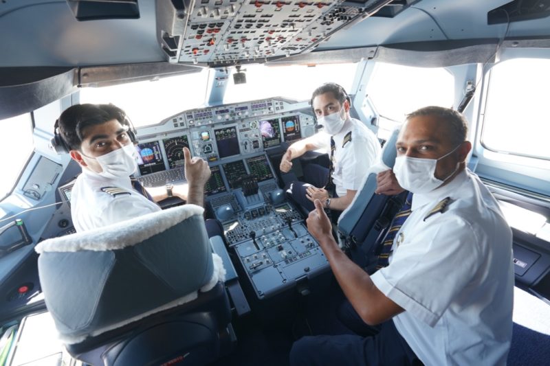 a group of men in a cockpit