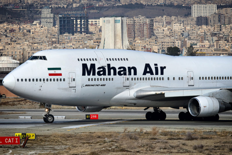 a large white airplane on a runway