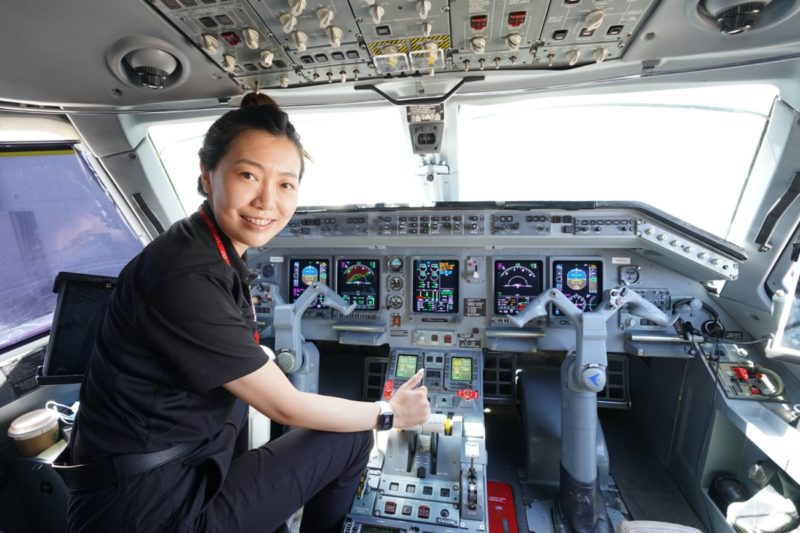 a woman in a cockpit of an airplane