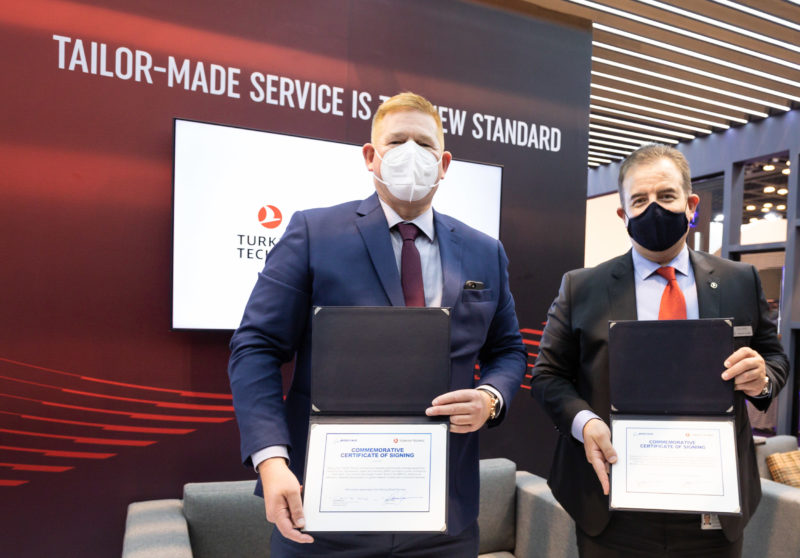 a group of men wearing masks holding papers