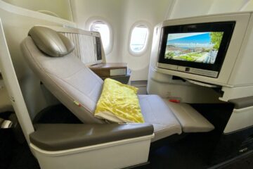 a seat in an airplane with a television