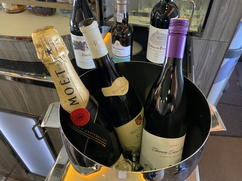 a bucket of wine with bottles in it