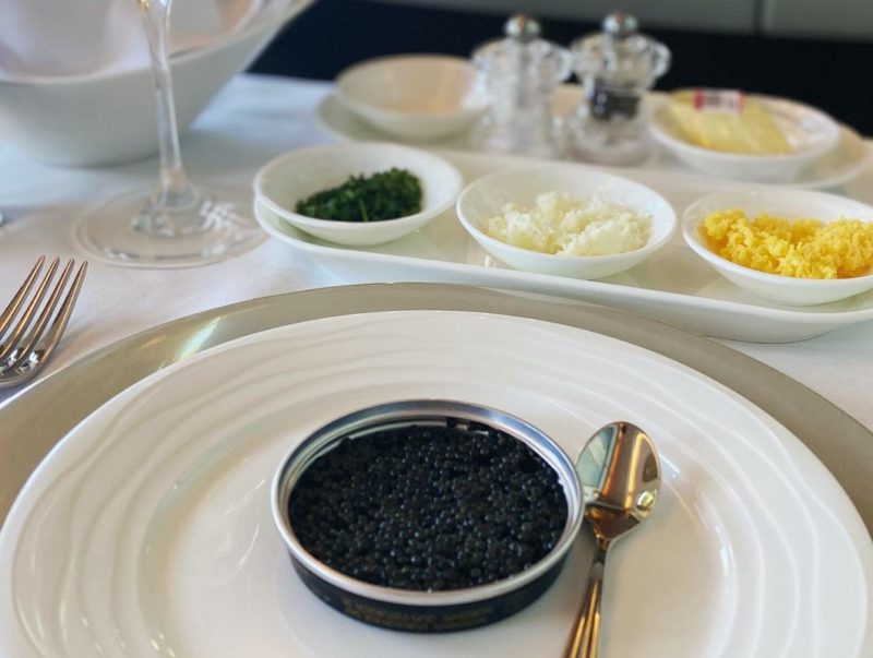 a plate with black caviar on it