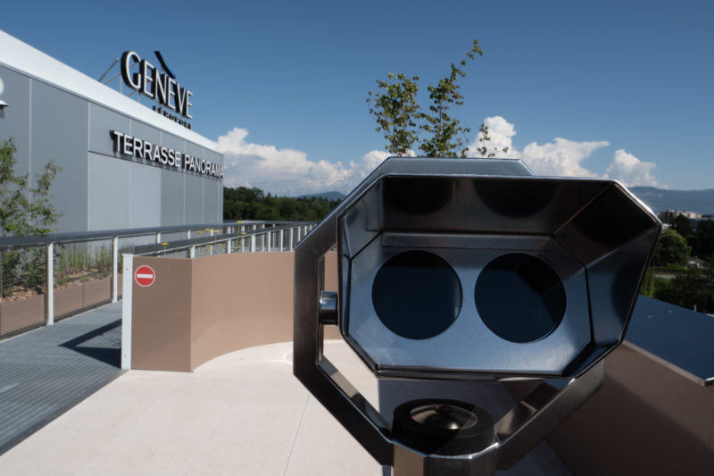 a telescope on a rooftop