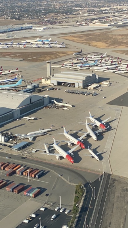 an aerial view of airplanes parked at an airport