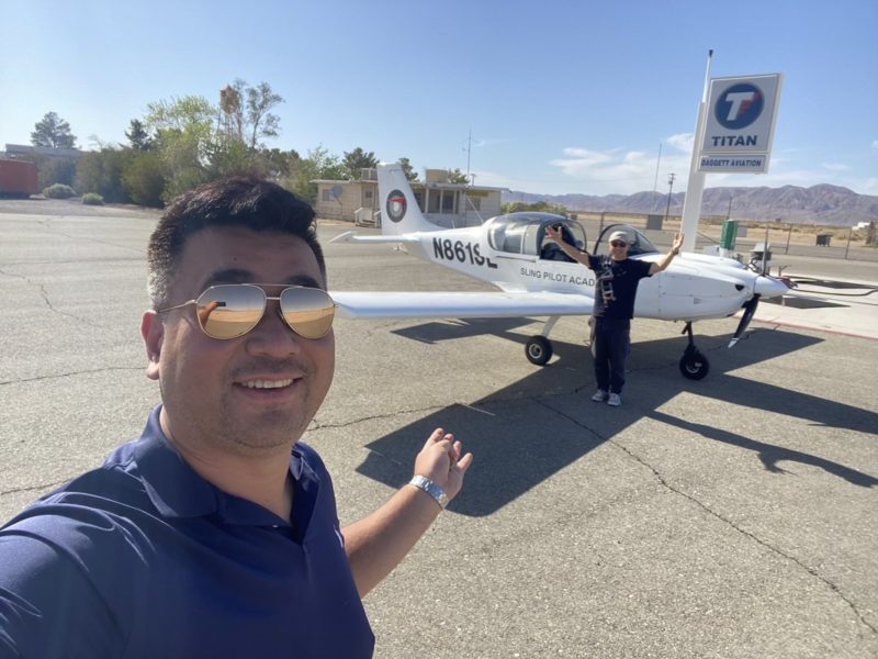 a man taking a selfie with a plane