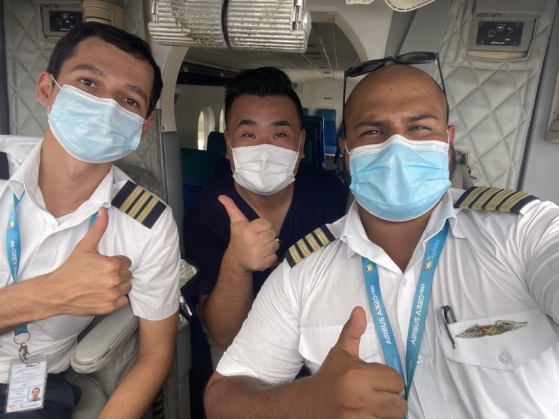 a group of men wearing face masks