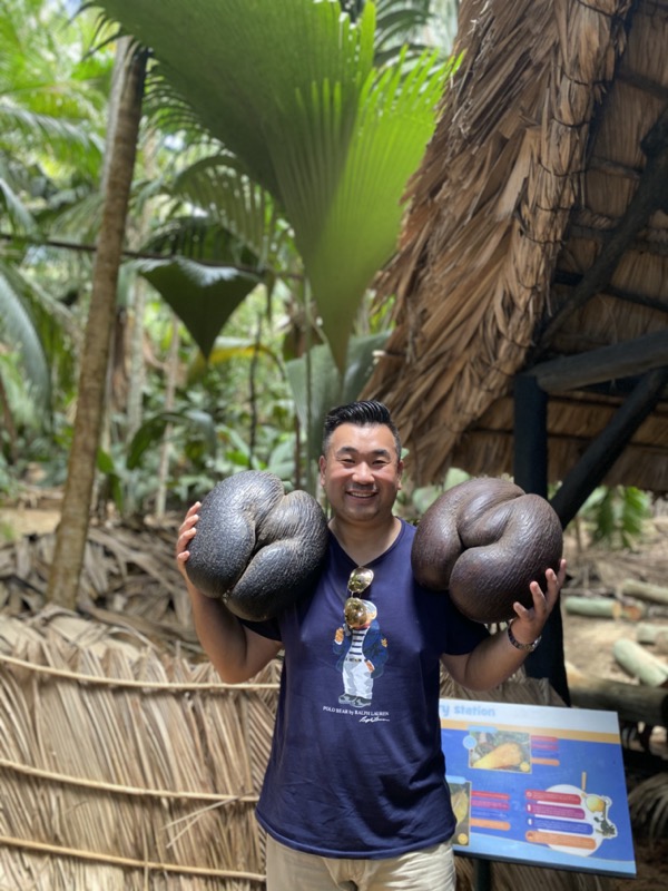 a man holding two large black objects