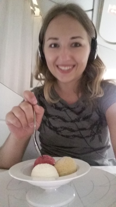 a woman wearing headphones and eating food