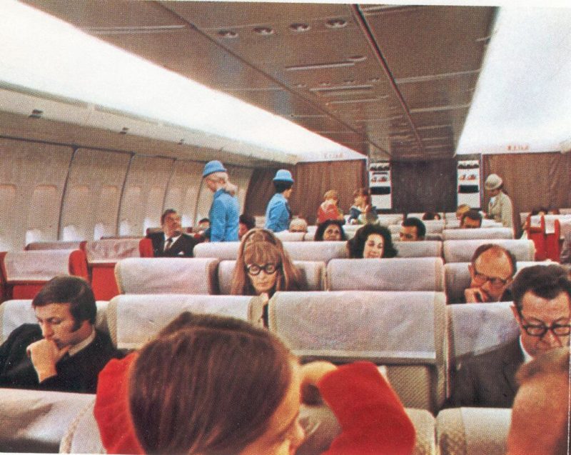 a group of people sitting in an airplane