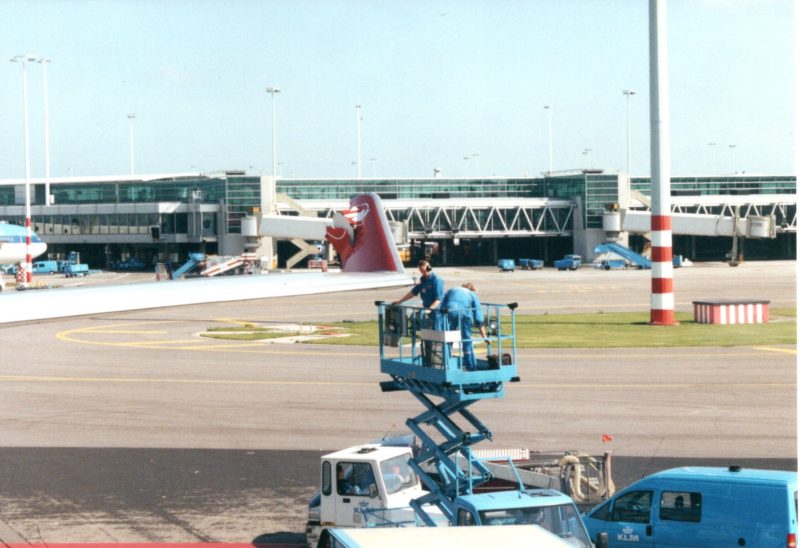 a man on a lift at an airport