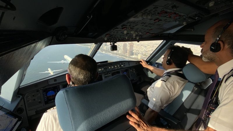a couple of men in a plane cockpit