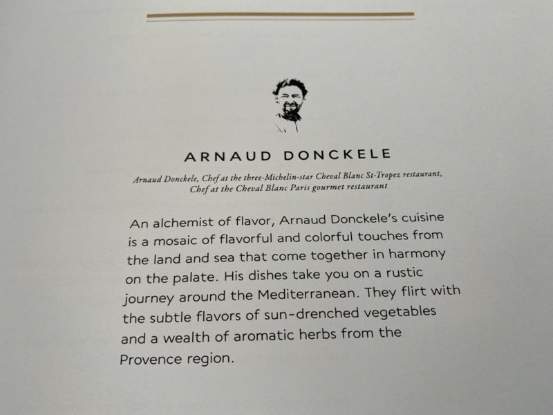 a menu with text and a picture of a man