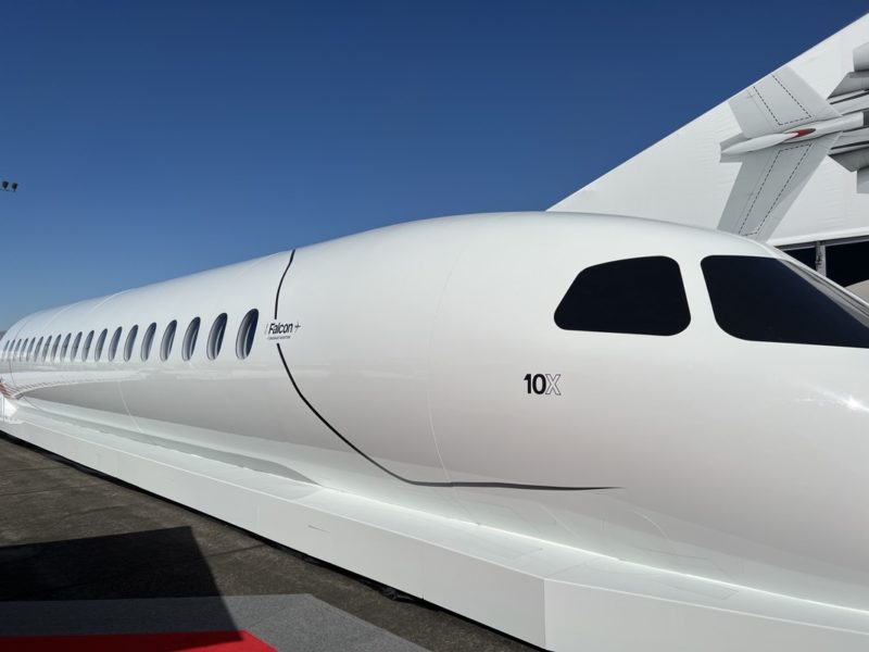 a white airplane on a runway