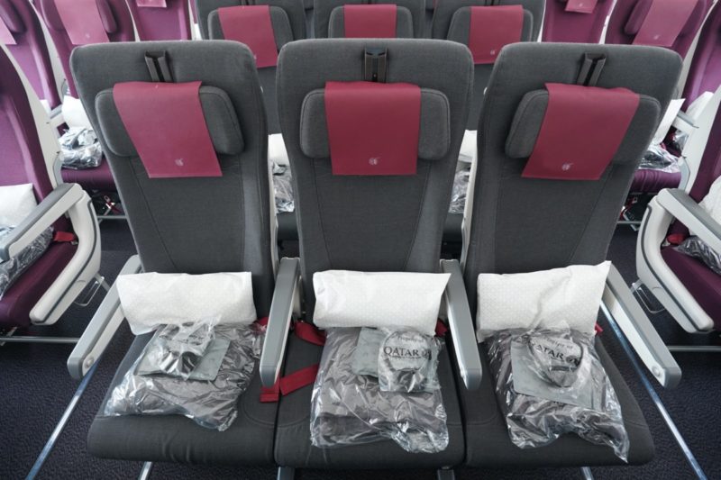 a row of grey and pink seats