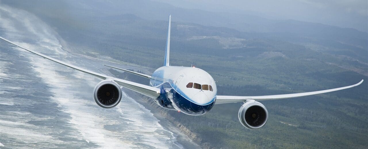 a plane flying over a body of water