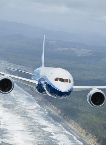 a plane flying over a body of water