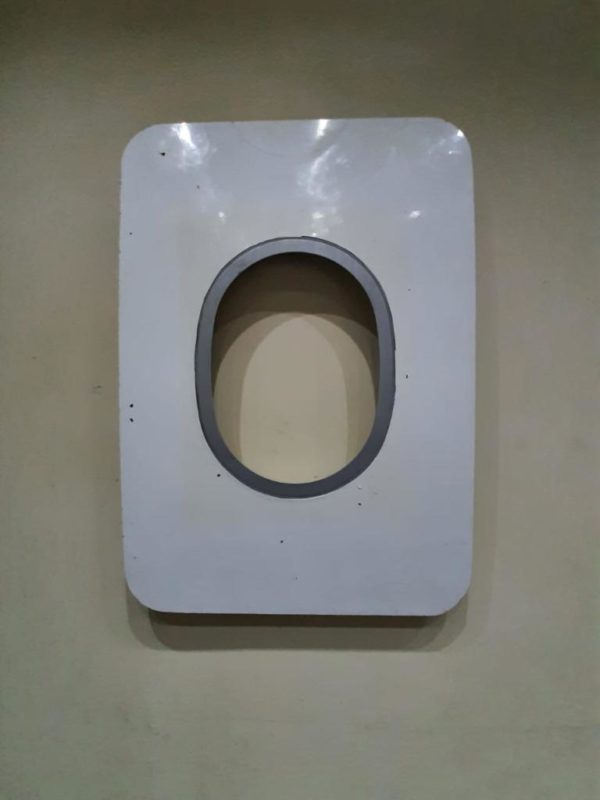 a white rectangular object with a round hole
