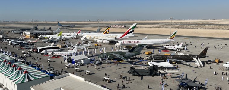 an airport with airplanes and people