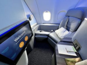 a tv and a table in an airplane