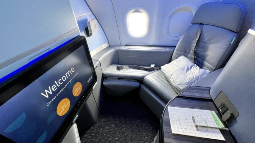 a tv and a table in an airplane