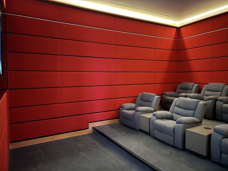 A room with red walls and some chairs