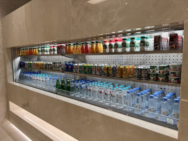 a shelf with drinks and beverages on it