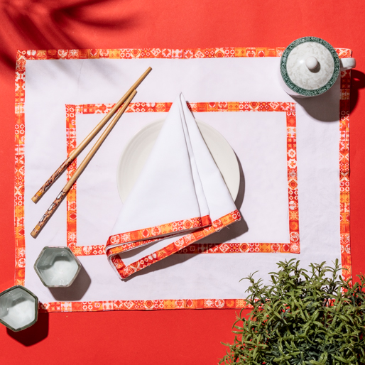 a place mat with chopsticks and a plate on it