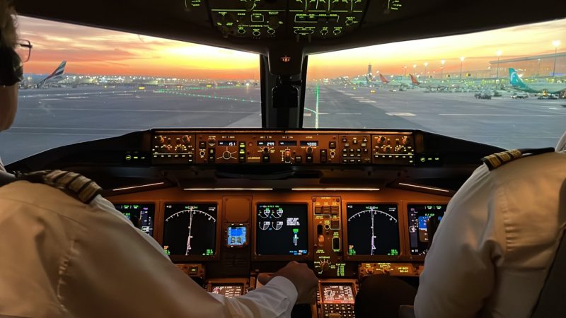 a cockpit of an airplane with a view of planes