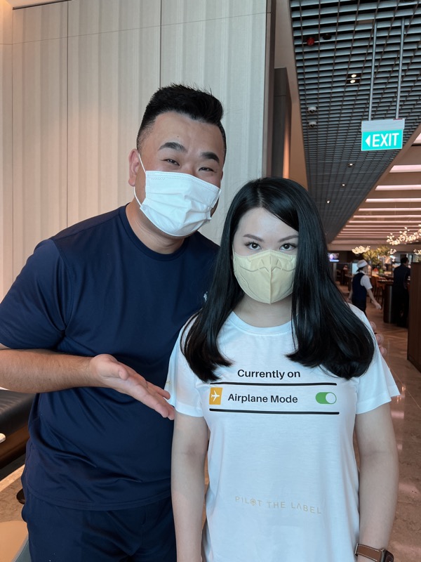 a man and woman wearing face masks