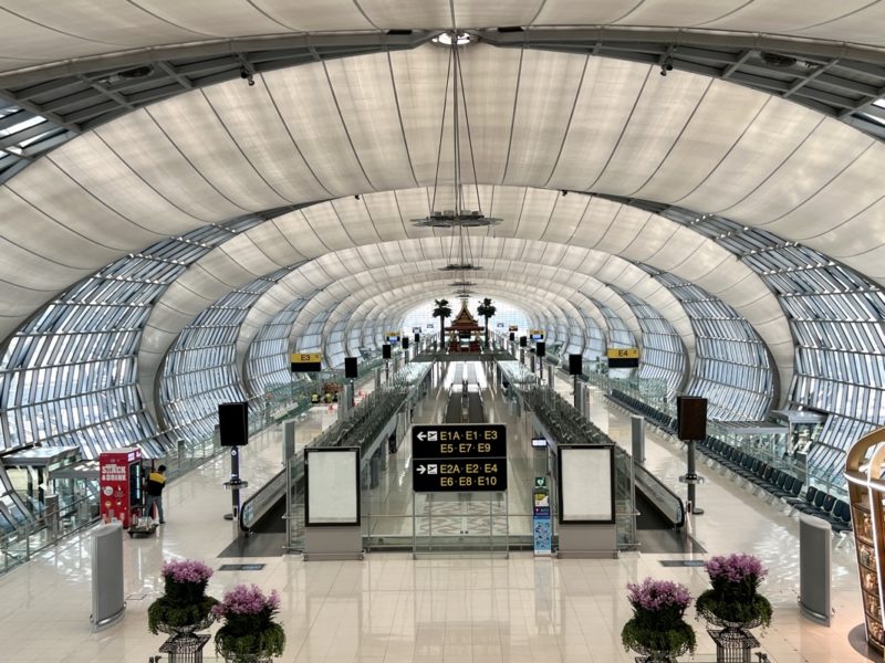 a large white tunnel with a walkway and walkways