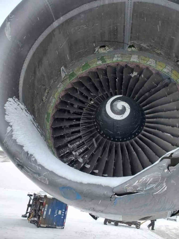 a jet engine with snow on it