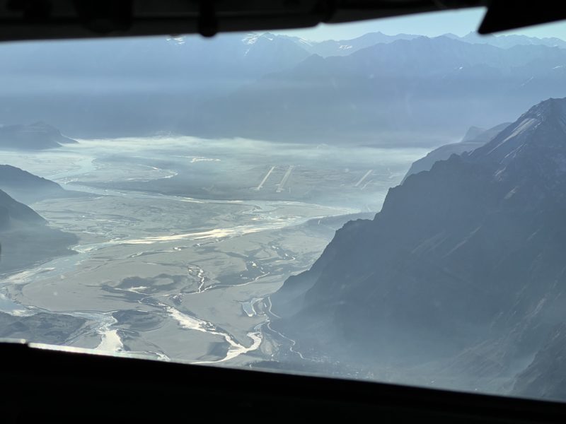 a view of a valley from a plane window