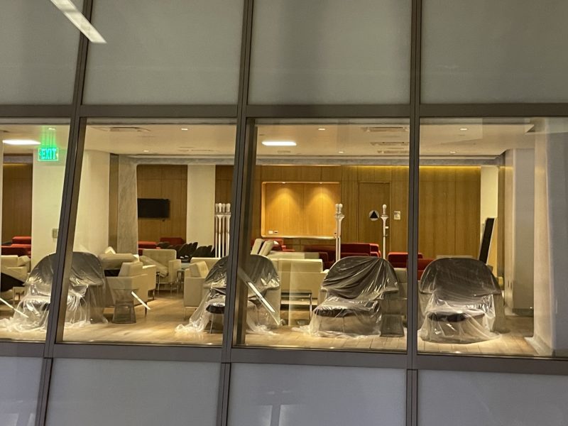 a room with chairs wrapped in plastic