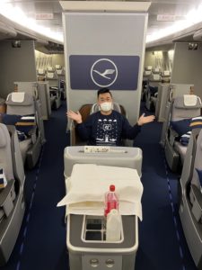 a man in a mask on an airplane