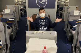 a man in a mask on an airplane