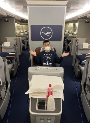 a man in a mask on an airplane