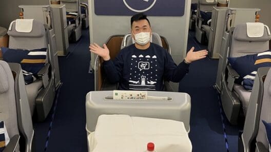 a man in a mask on an airplane